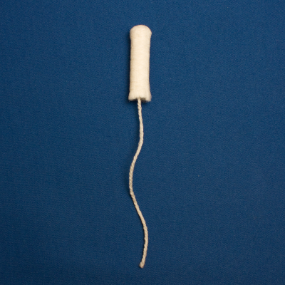 A tampon removed from its applicator A tampon removed from its applicator