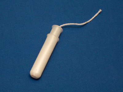 A tampon still in its plastic applicator A tampon still in its plastic applicator
